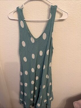 Sleeveless white polka dot dress